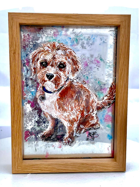 Framed painted portrait on glass.